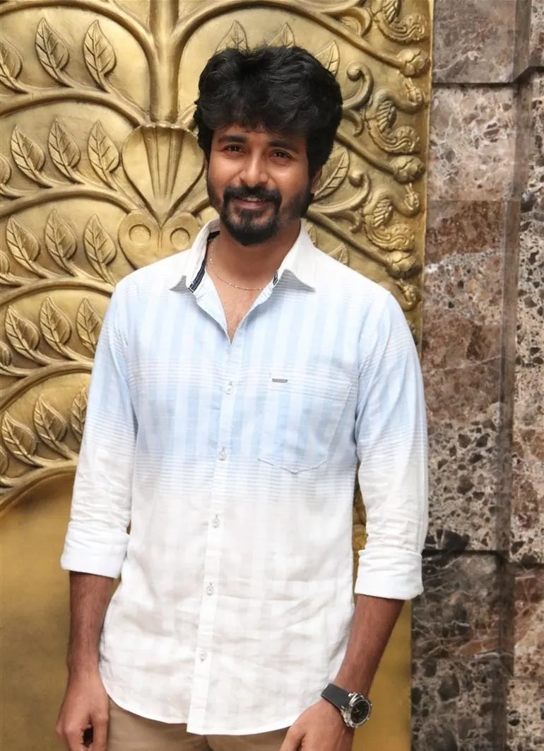 Sivakarthikeyan in a Colourful Shirt Standing Wallpaper