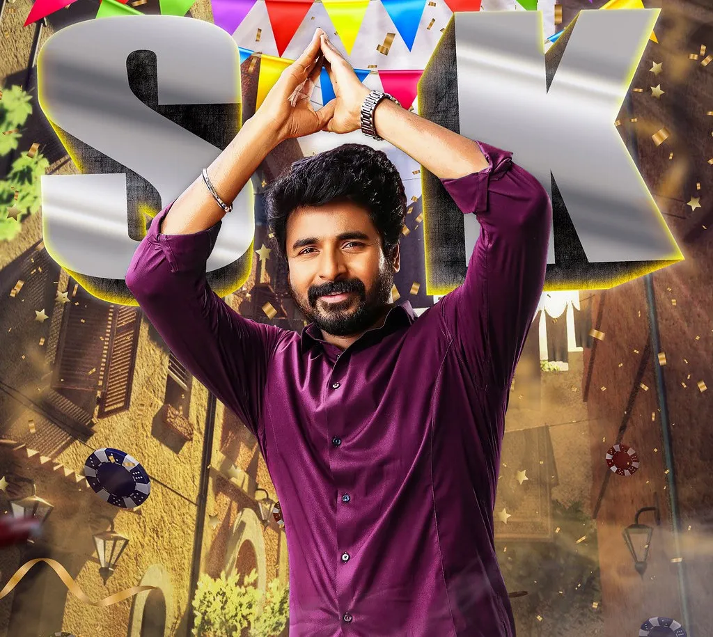 Sivakarthikeyan in a Violet Shirt with His Hands Raised