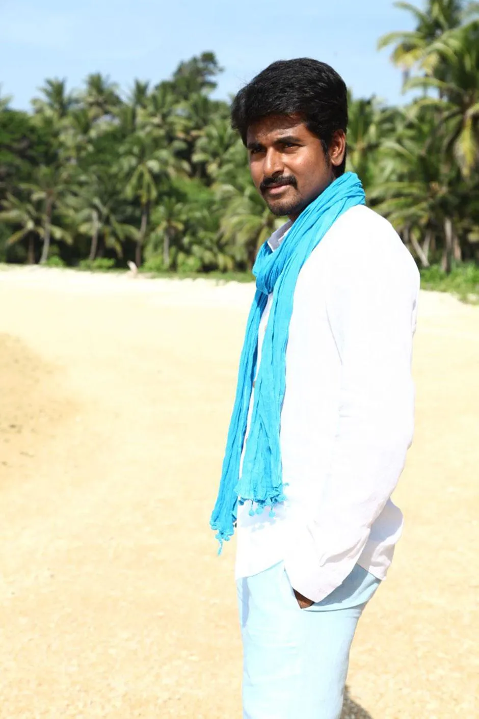 Sivakarthikeyan in a White Outfit with a Blue Shawl Image
