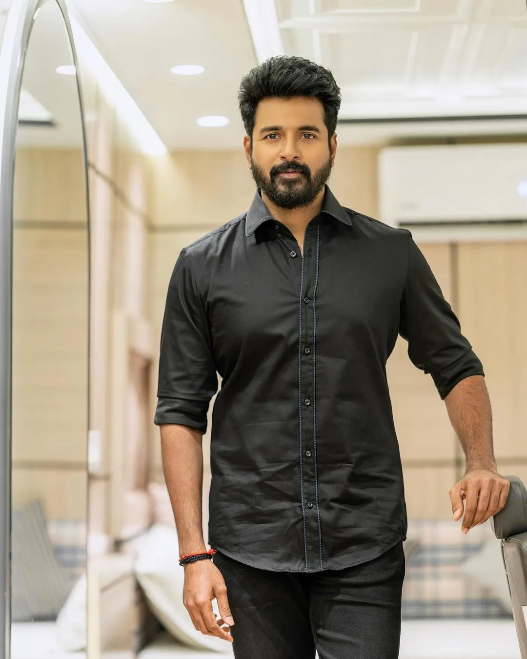 Sivakarthikeyan in Black Shirt Standing on a Cozy Room Hd