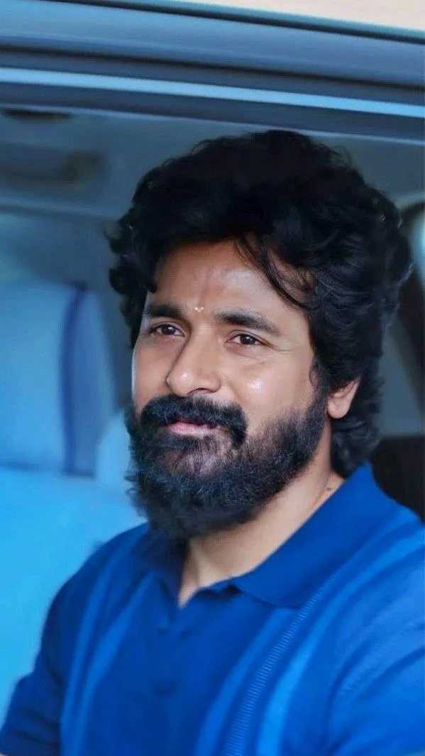 Sivakarthikeyan in Blue Polo Shirt Smiling HD Wallpaper
