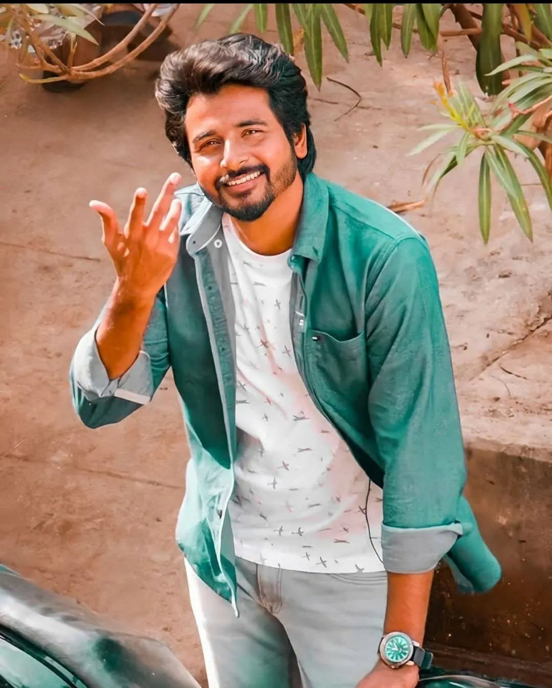 Sivakarthikeyan in Casual Standing Near a Bike a Remo Still