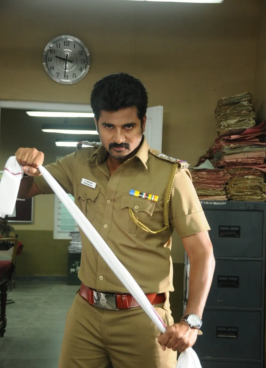 Sivakarthikeyan in Police Uniform Inspecting Evidence Image