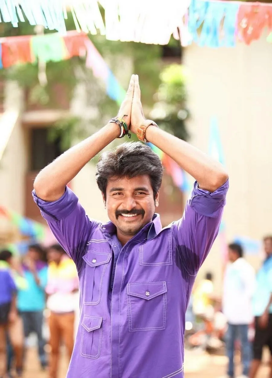 Sivakarthikeyan in Purple Shirt and Vannakkam Pose Wallpaper