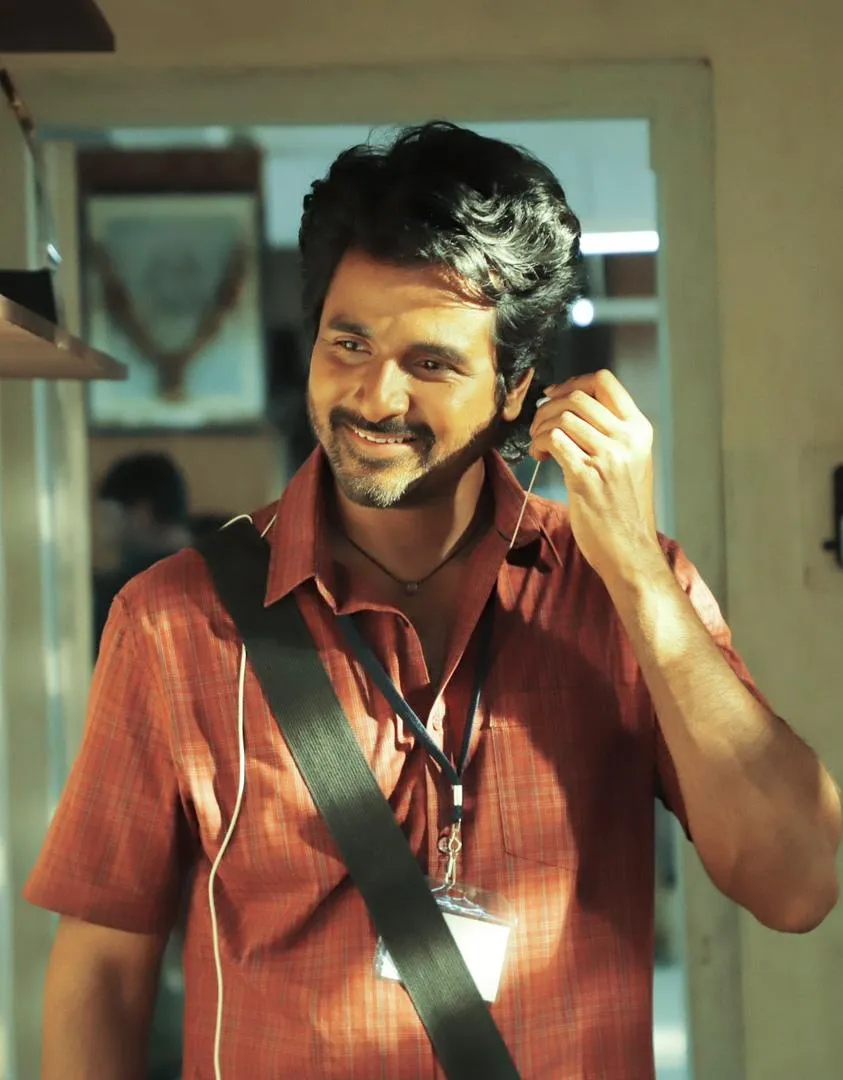 Sivakarthikeyan in Red Shirt Wearing on Earphone Wallpaper