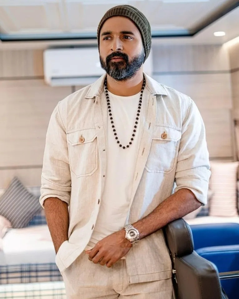 Sivakarthikeyan in White Outfit and Beanie in Modern Setting