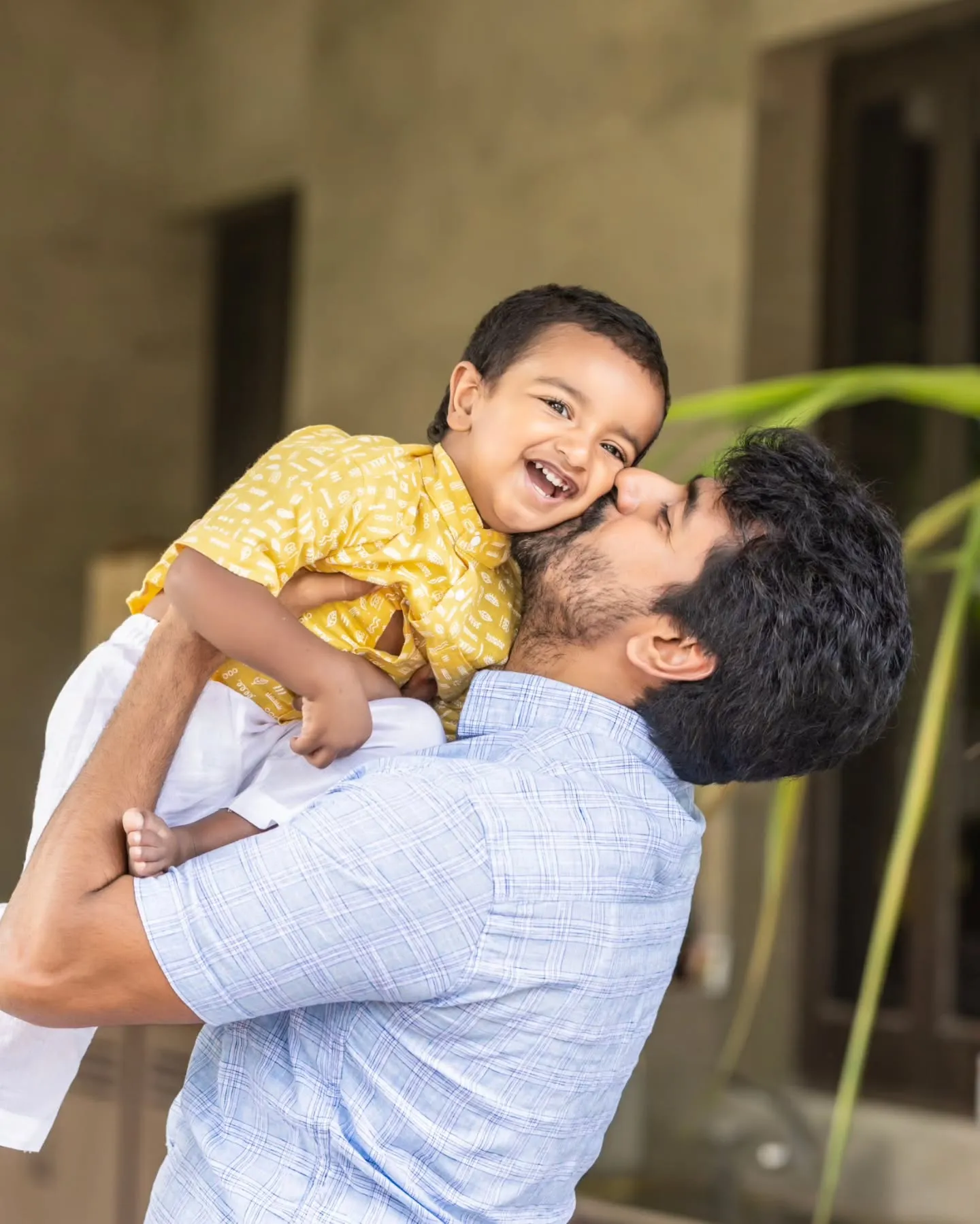 Sivakarthikeyan Lifting His Son Gugan Doss and Kissing Image