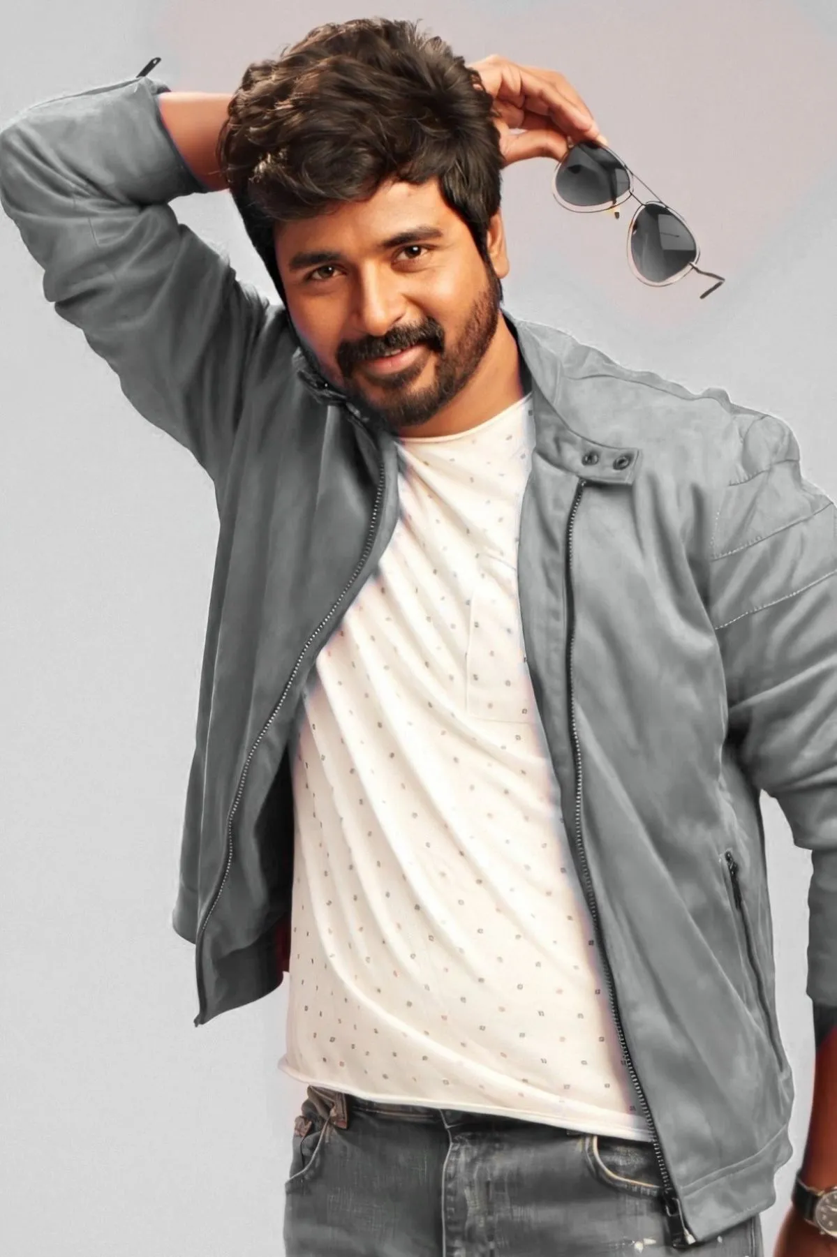Sivakarthikeyan Playful Pose with Sunglasses in Hand Image