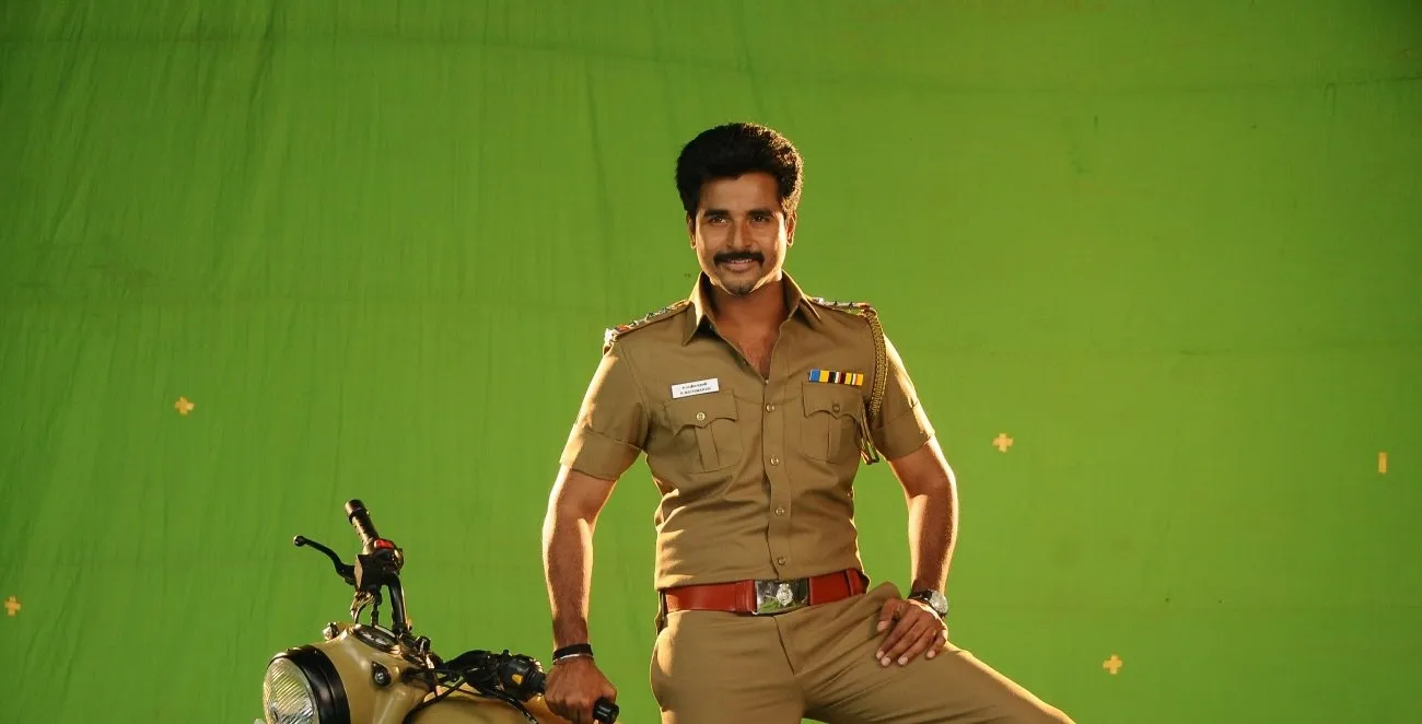 Sivakarthikeyan Sitting Calmly in Police Uniform Wallpaper