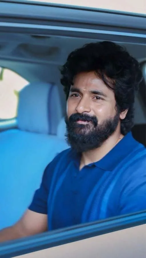 Sivakarthikeyan Sitting in Car Wearing Blue Shirt Smiling