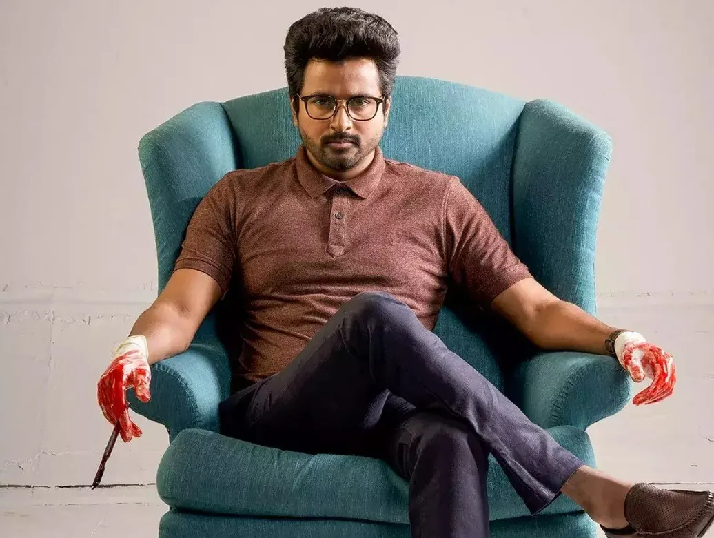 Sivakarthikeyan Sitting in Chair with Serious Expression