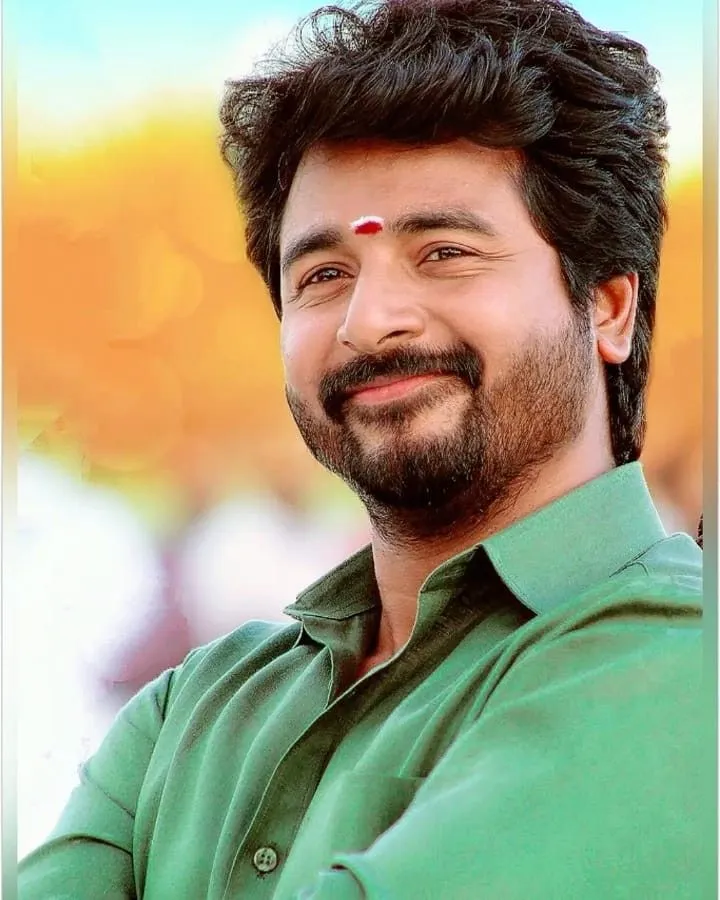 Sivakarthikeyan Smiling in Green Shirt with Red Vibhuti