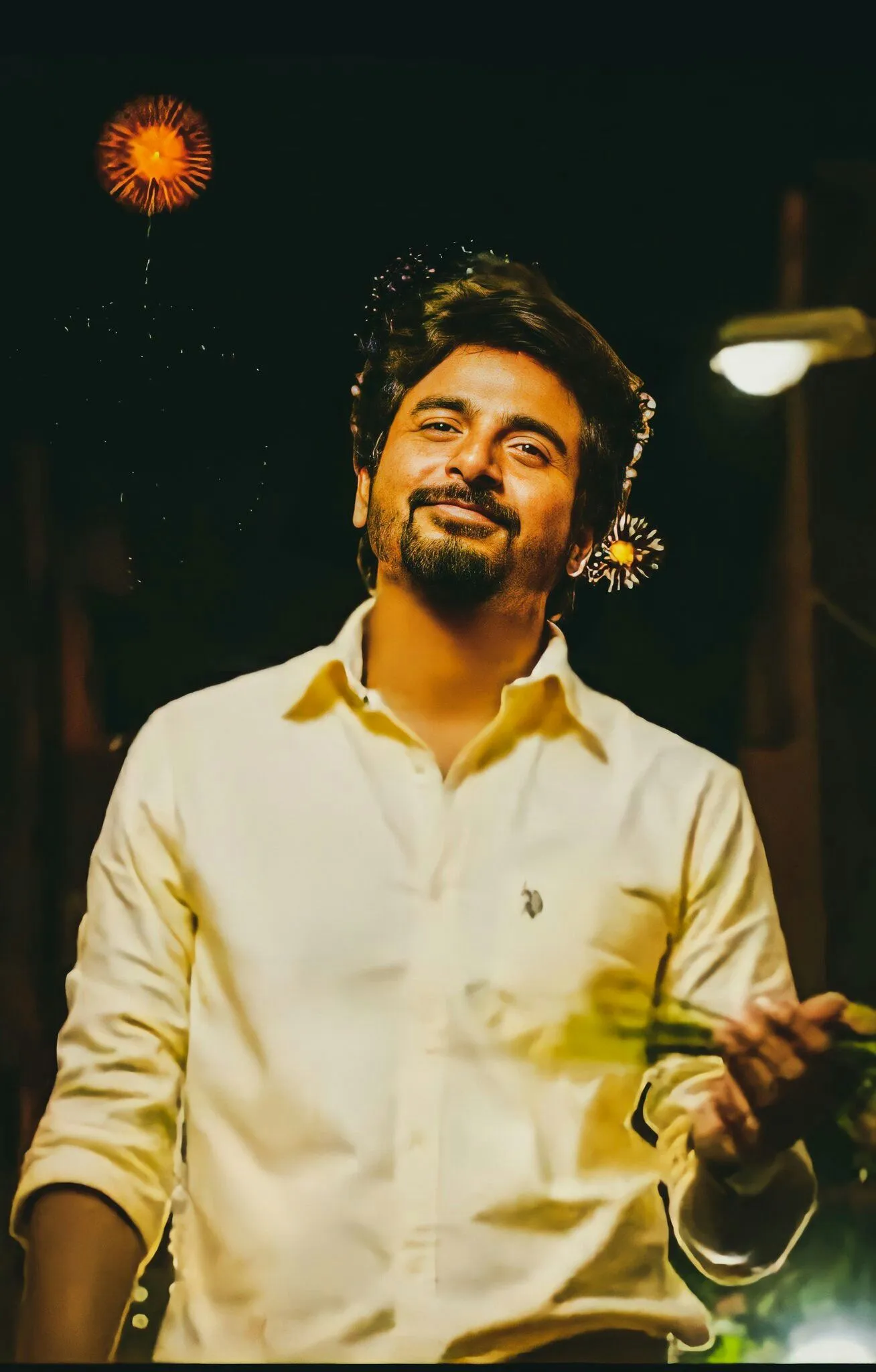 Sivakarthikeyan Smiling Outside with Night Lights HD Image