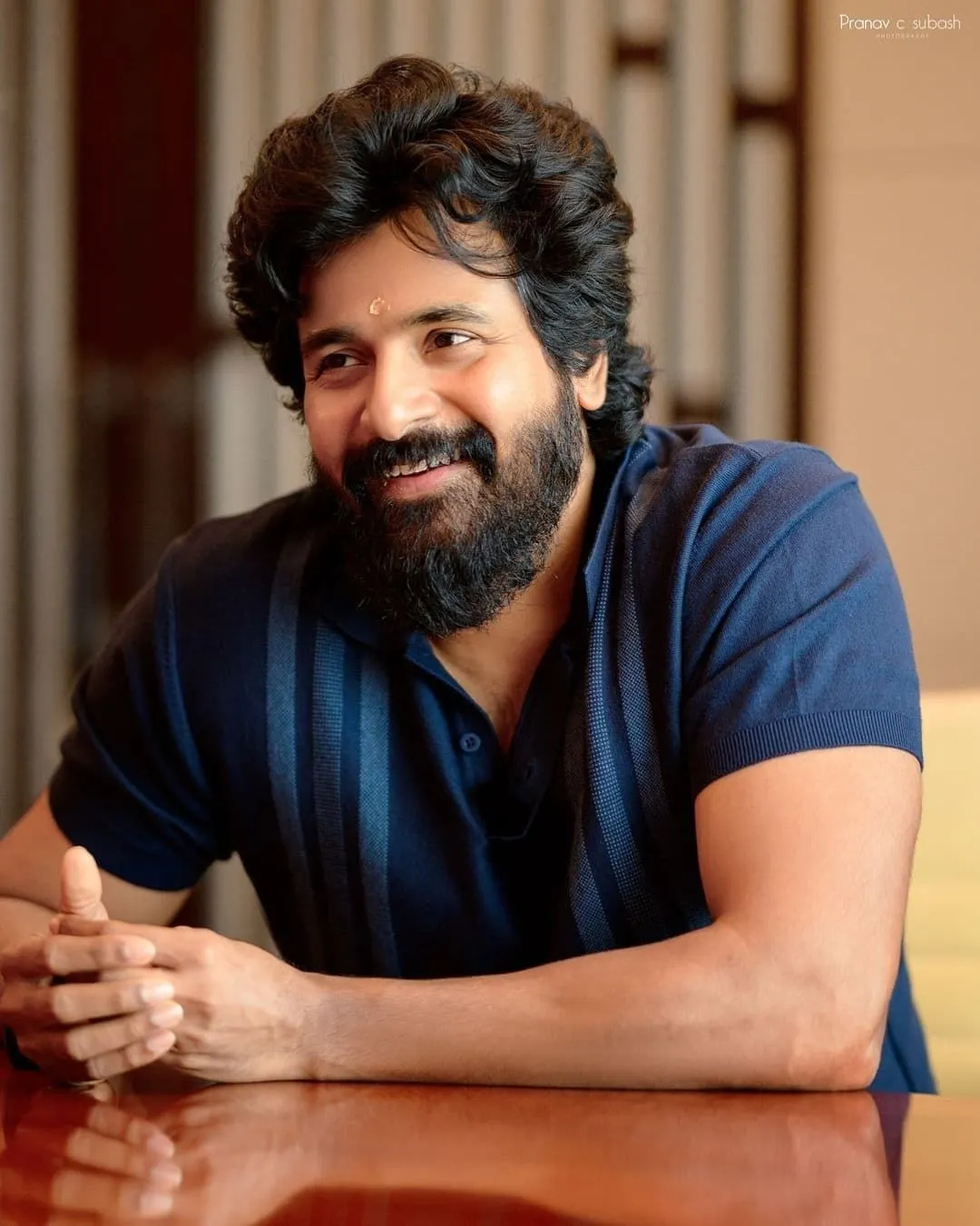 Sivakarthikeyan Smiling Warmly in Casual Indoor Setting