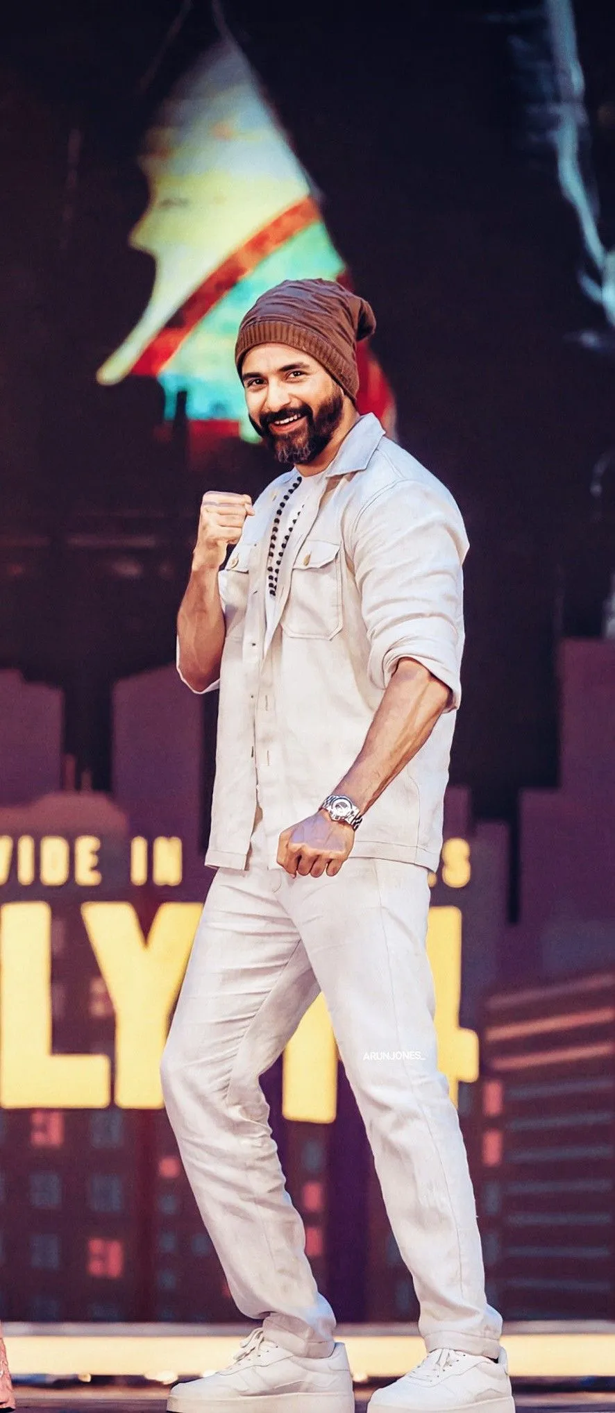 Sivakarthikeyan Standing on Stage with Fight Pose Image