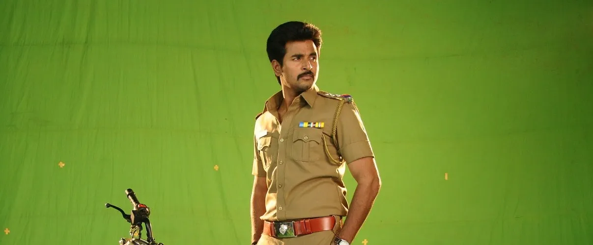 Sivakarthikeyan Standing Proudly in Police Attire with Bike