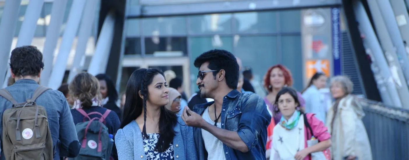Sivakarthikeyan Walking with Sri Divya Through a Crowd Image