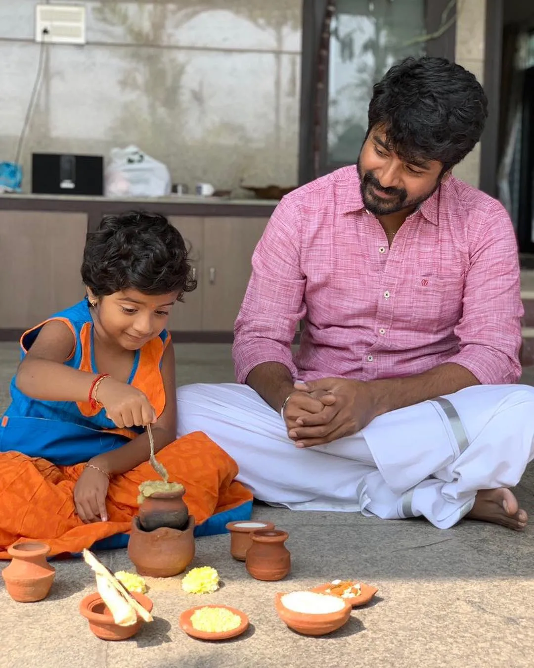 Sk Sitting with Aaradhana and Playing with Clay Pots