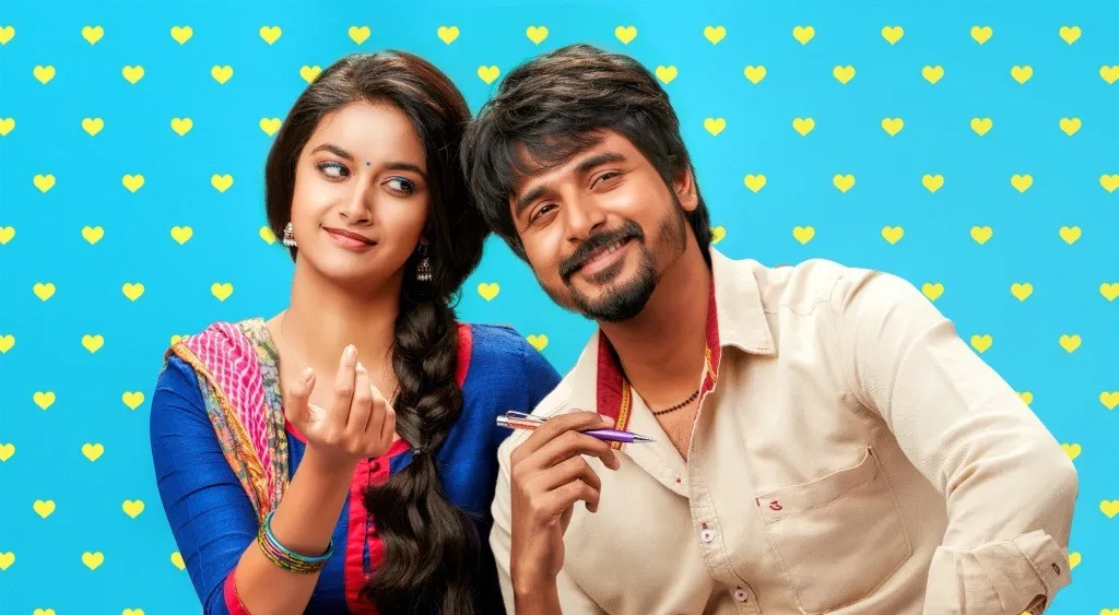Sk with Keerthi Suresh Posing Playfully on Blue Background