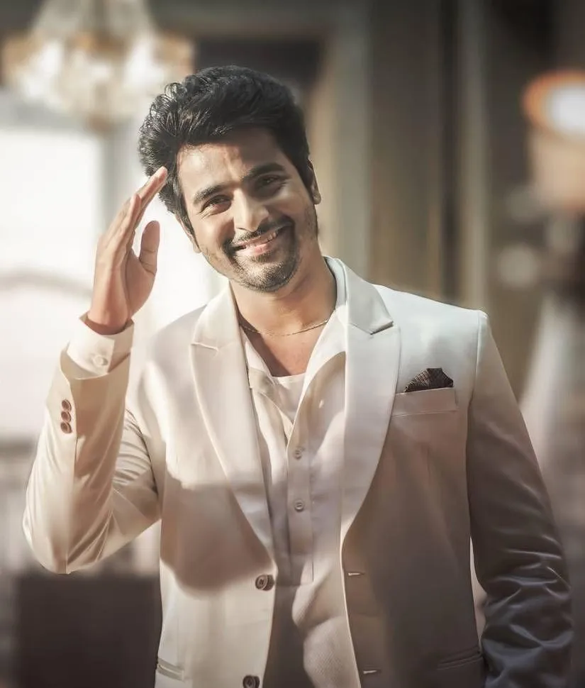 Stunning Pose of Sivarthikeyan in a Cream Coat and a Smile