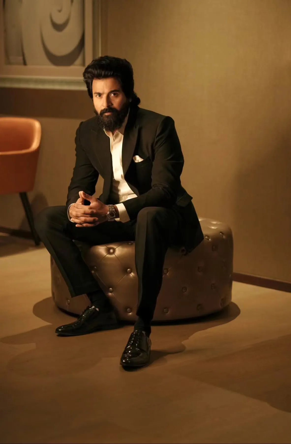 Stunning Sivakarthikeyan in Elegant Suit Look Sitting on Sofa