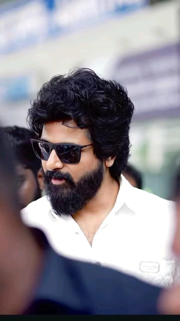 Stylish Look of Sivakarthikeyan in a White Shirt and Glasses