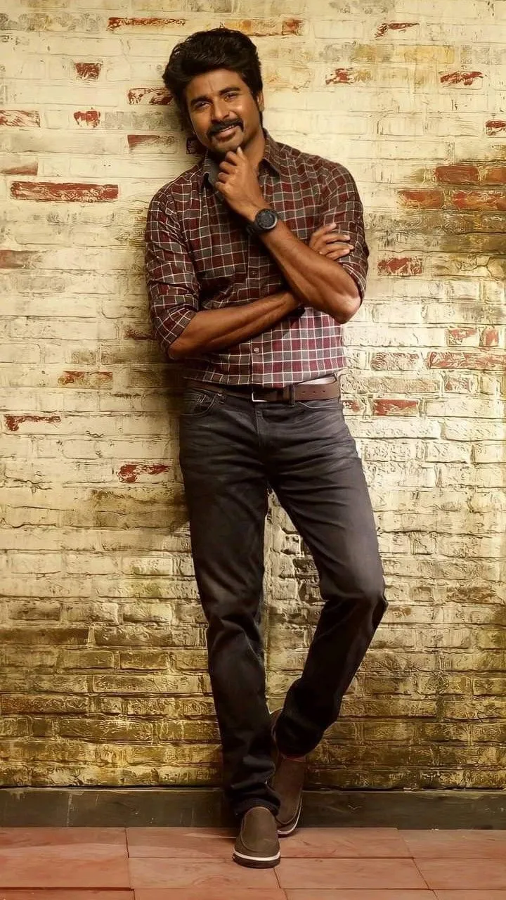 Stylish Standing Pose of Sivakarthikeyan with Cute Smile