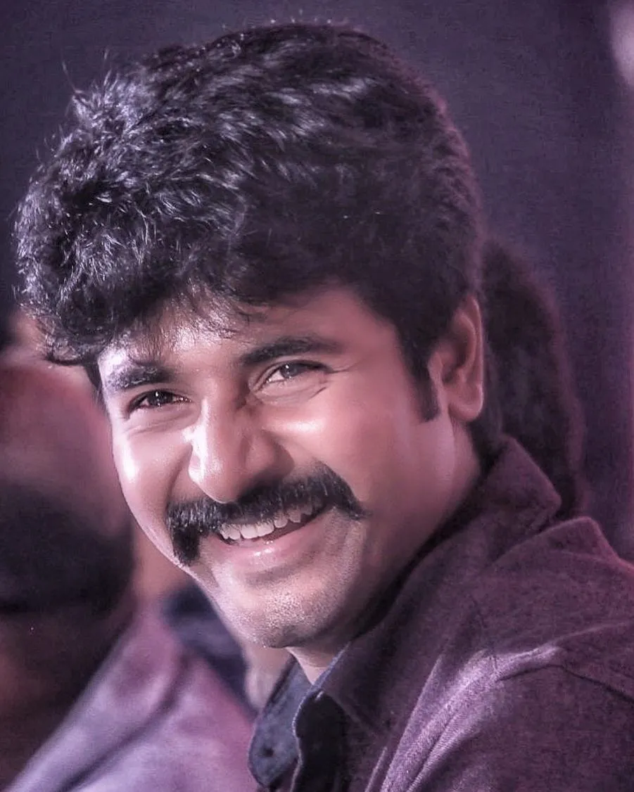 Wallpaper of Sivakarthikeyan with a Wide Smile Free Hd