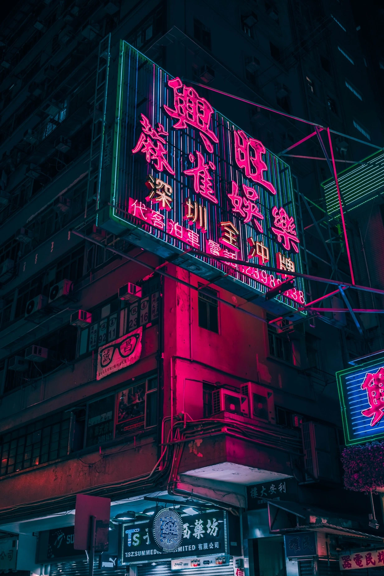 Vibrant Neon Building Lights in Urban Night Street for free