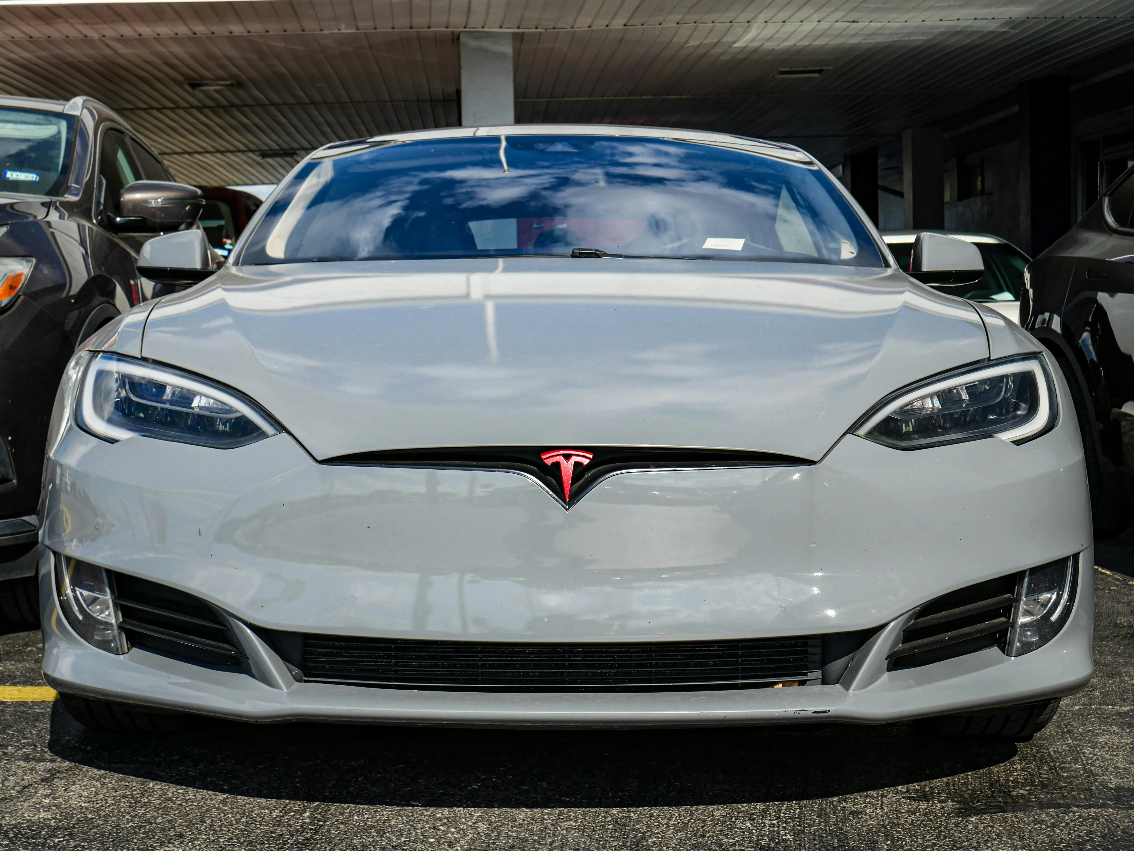 4K in White Tesla Model S Front View in Outdoor Parking Area