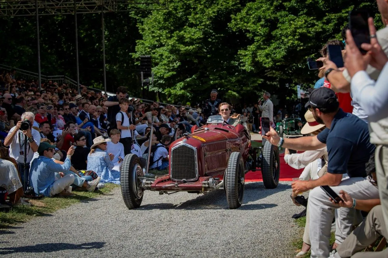 A Classic Bmw Sports Car with Spectators at a Car Event