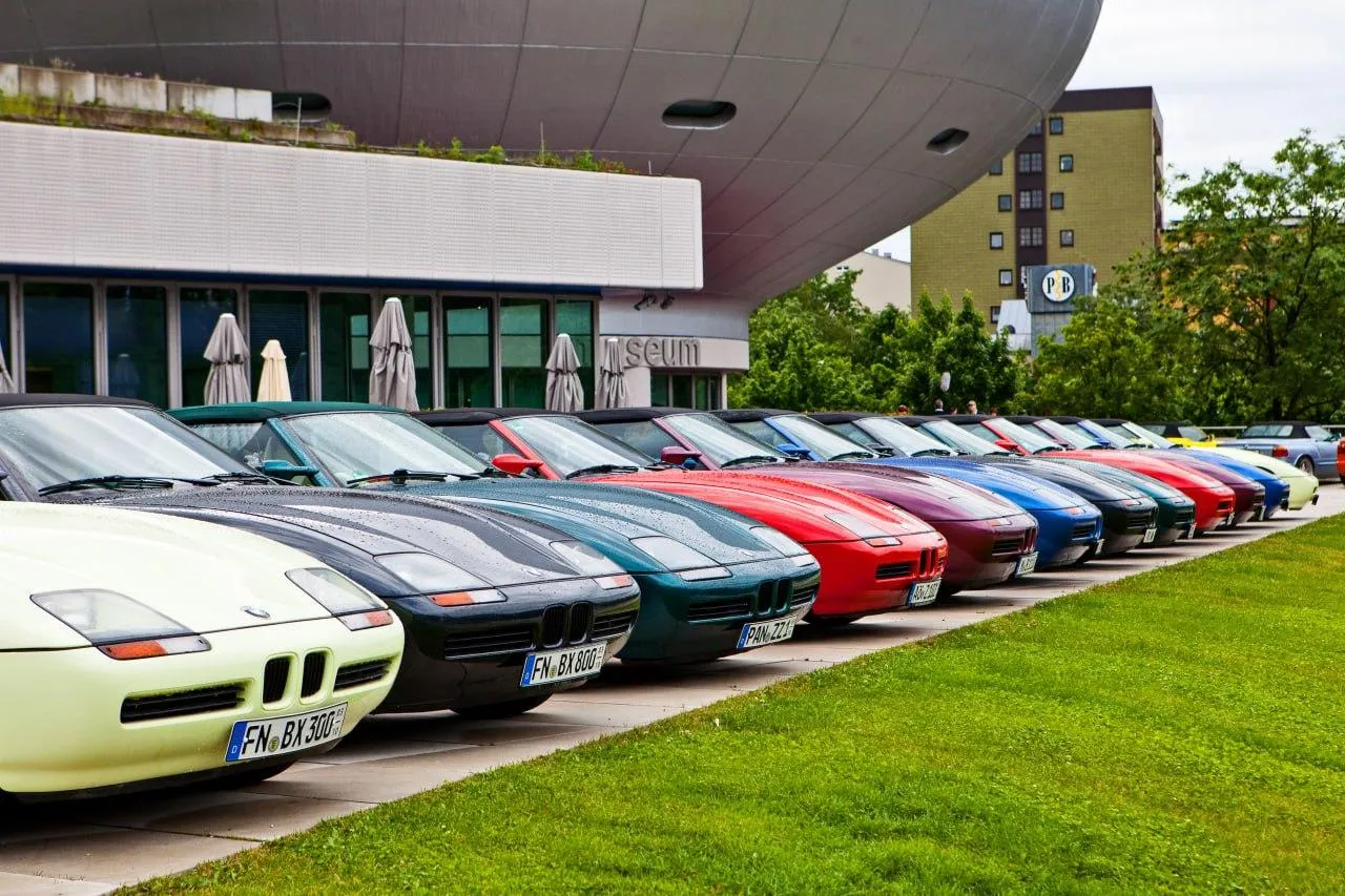 A Variety of Bmw Cars Lined Up Showcasing Various Models