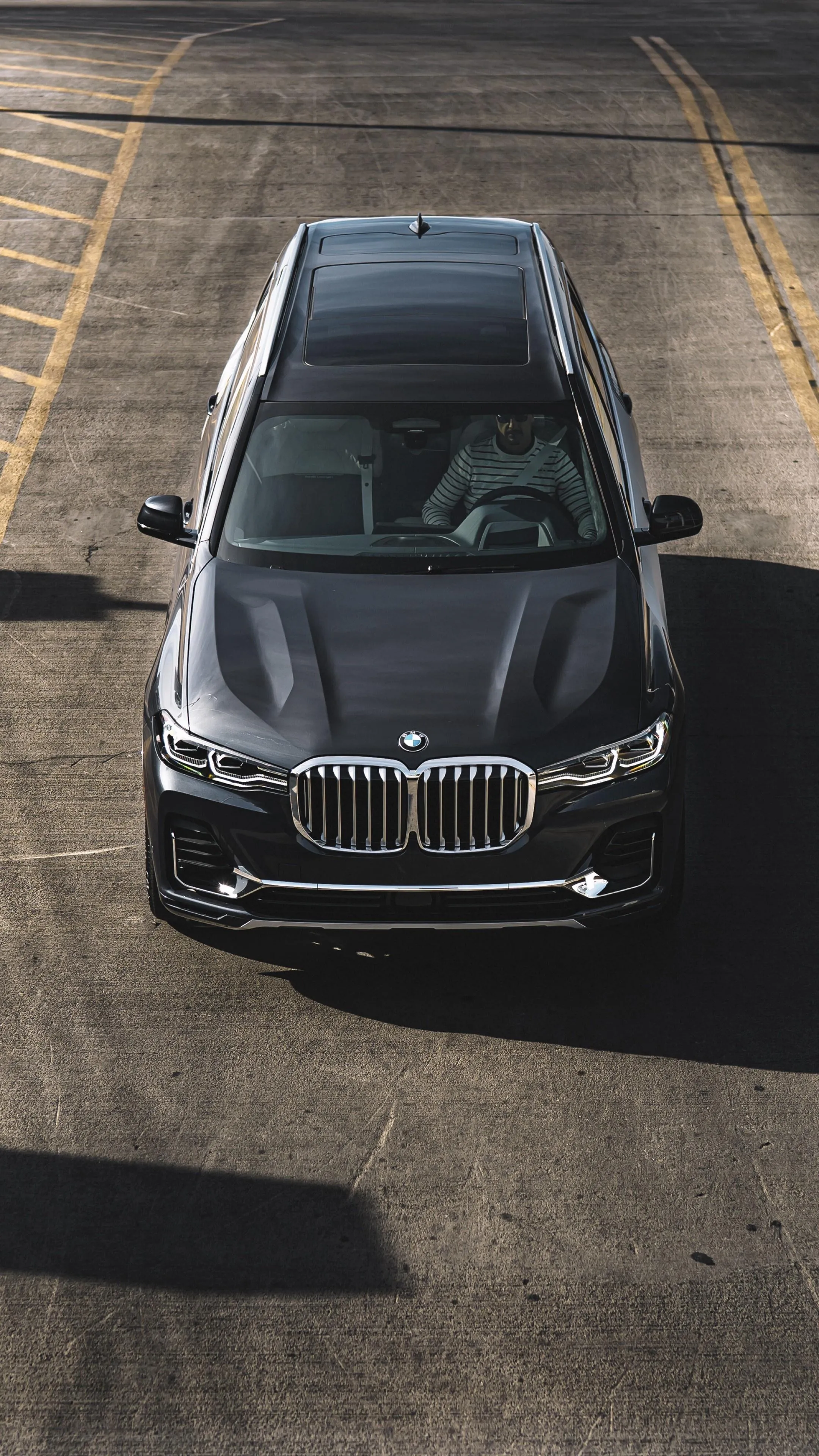Aerial View of Black Bmw in Vertical Parking Spot Wallpaper