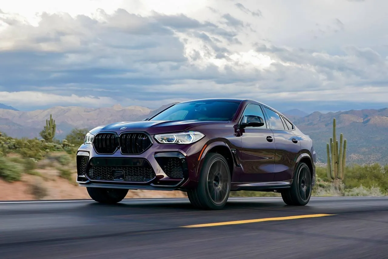 Aggressive Black Bmw Suv Driving Fast on Desert Highway