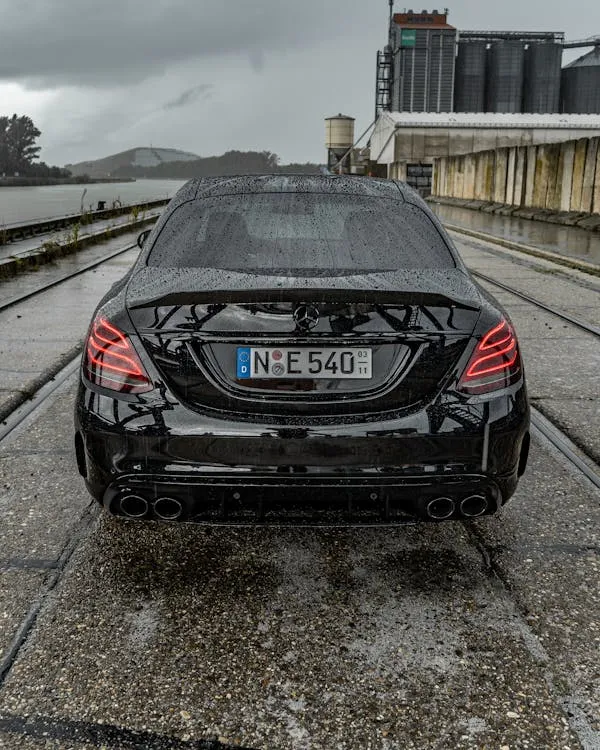 Amazing Rear View of Mercedes Sedan on Snow Covered Track