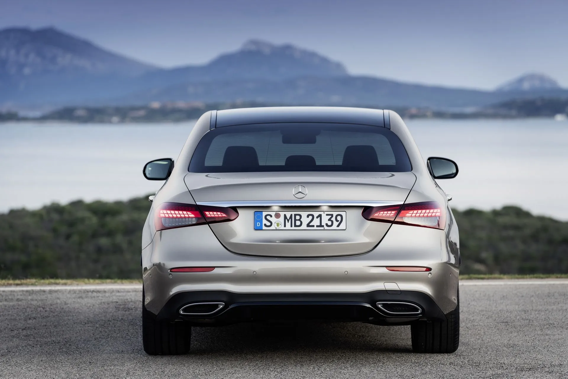 Back View of Mercedes Sedan by Mountain Lake Scene image