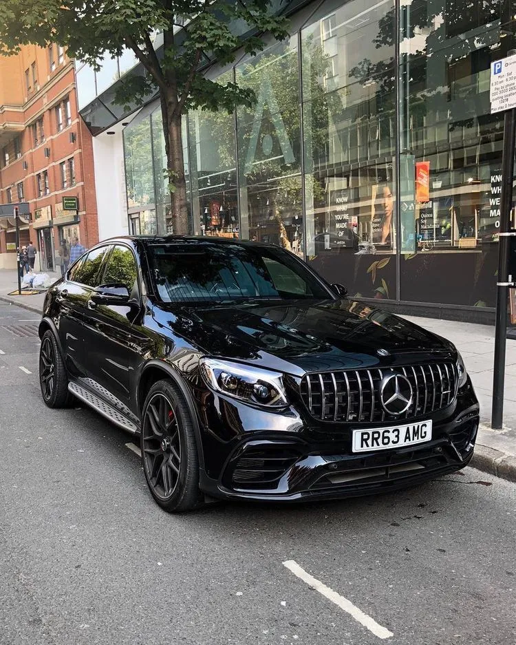 Black AMG Mercedes Sedan on Urban City Street Display