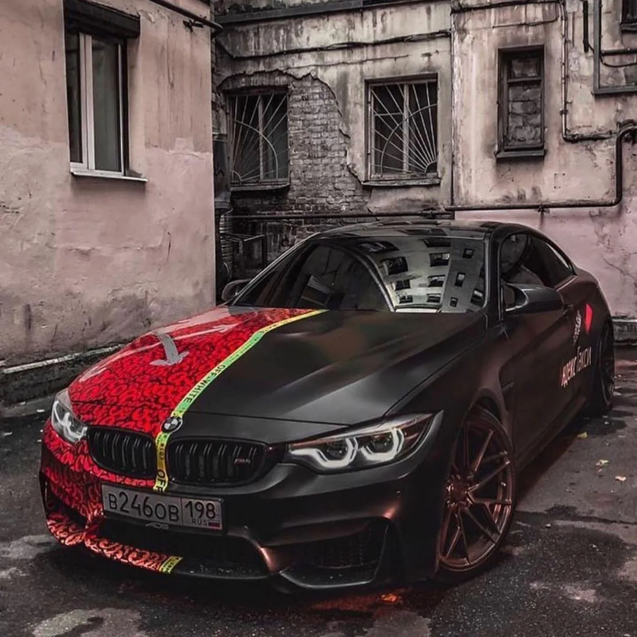 Black and Red Custom Bmw Parked in Urban Alleyway Wallpaper
