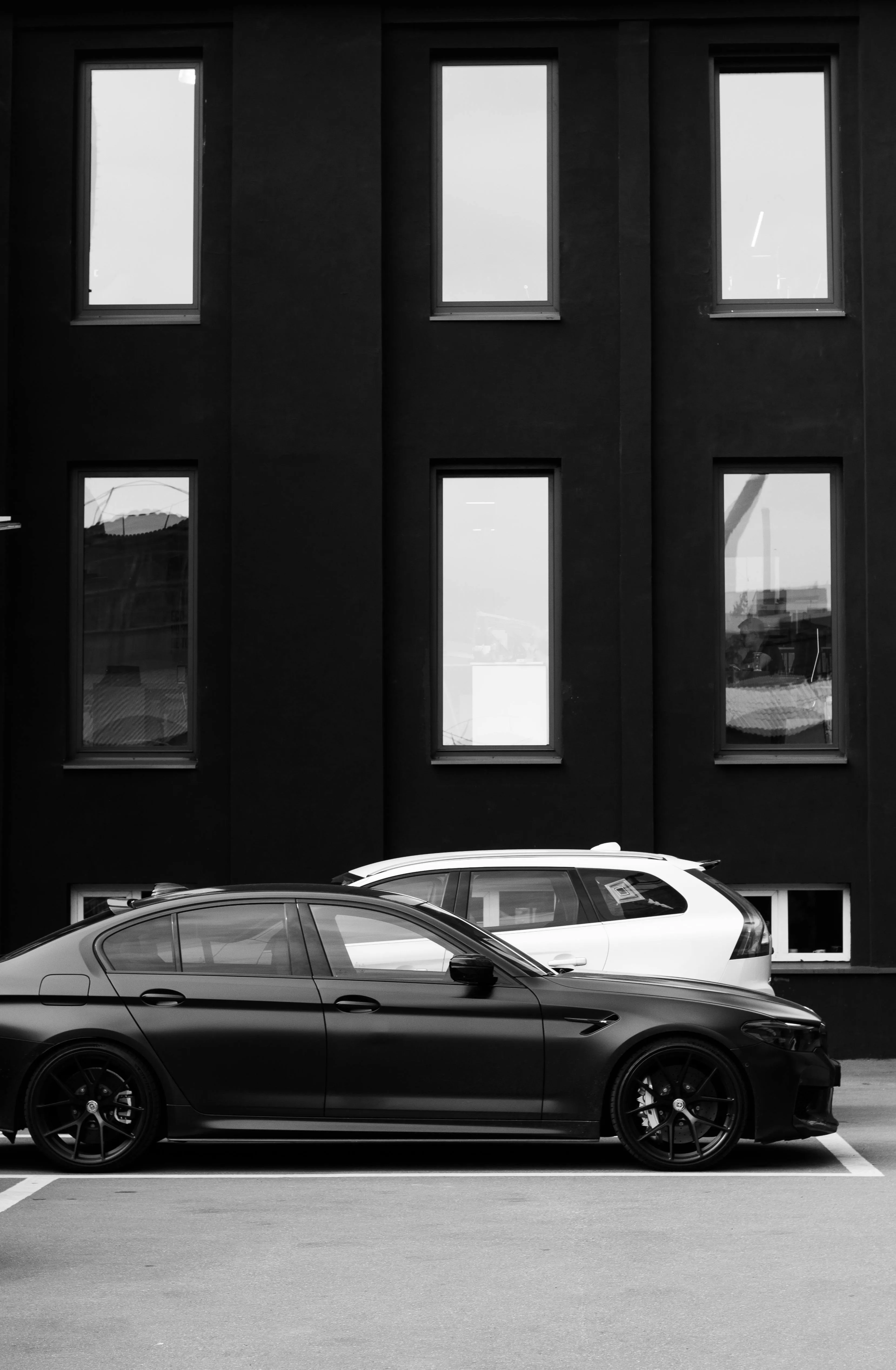 Black and White Bmw Sedan Parked Beside Tall Building Hd