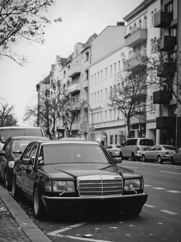 Black and White Photo of Classic Mercedes Benz on Street