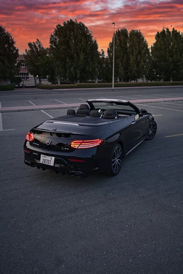 Black Benz Convertible Parked at Sunset Road Wallpaper
