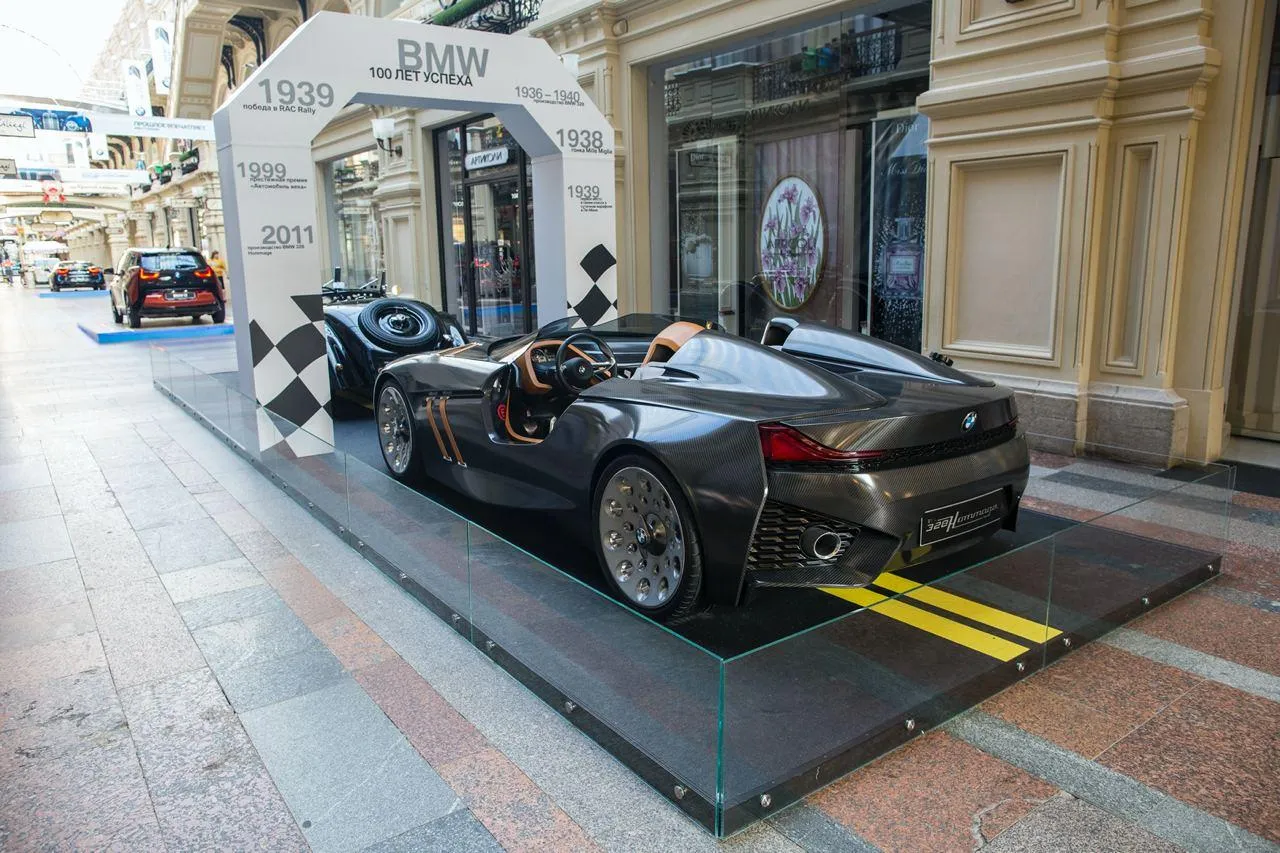 Black Bmw Car Displayed in City Street Exhibition Wallpaper