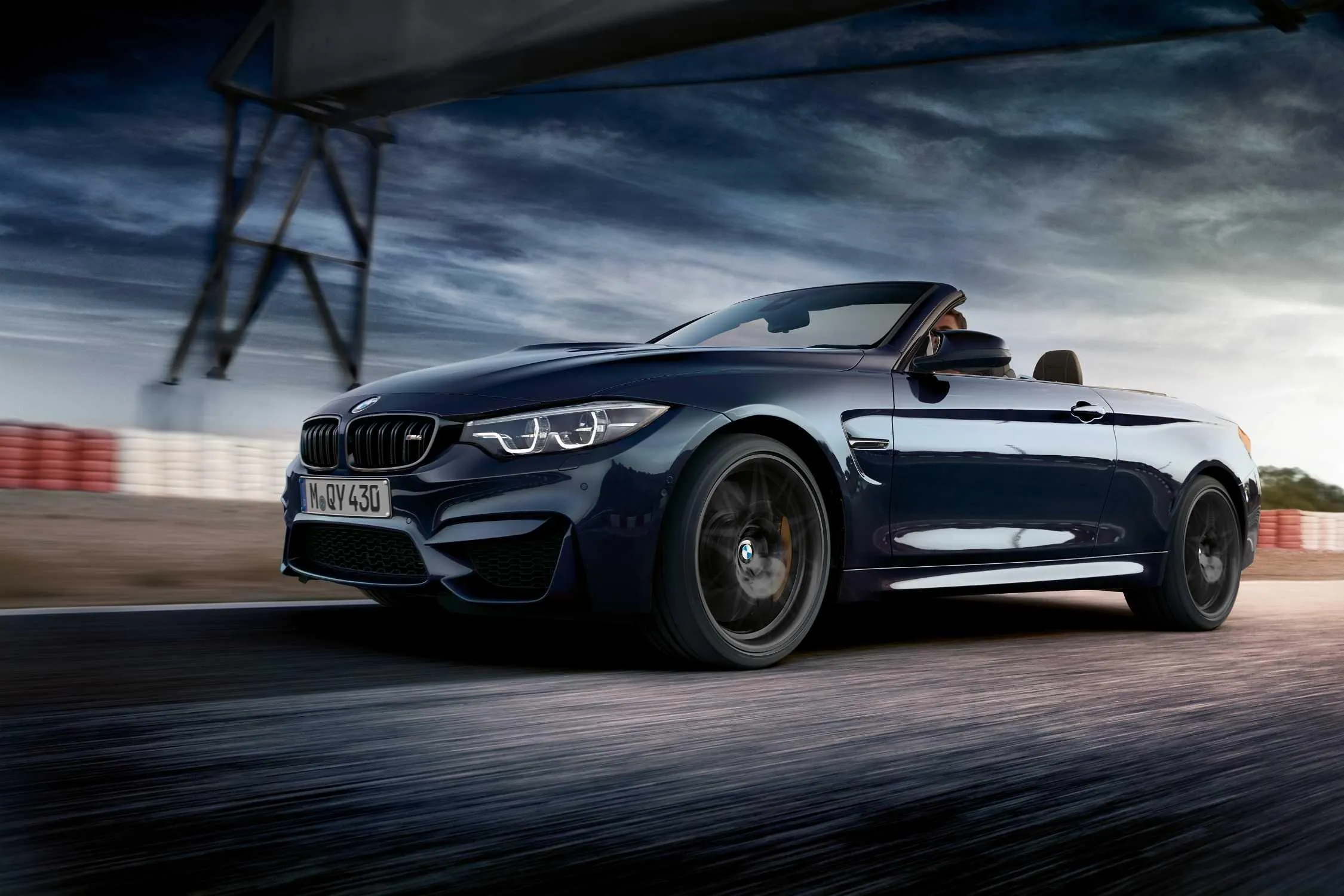 Black Bmw Convertible Car Driving on a Curvy Road Wallpaper
