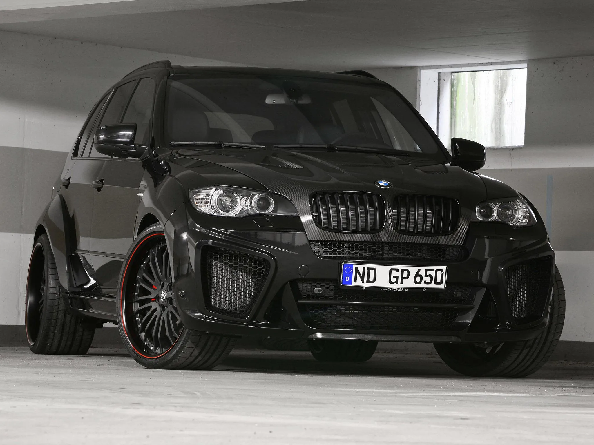 Black Bmw Hatchback in Garage with Sporty Look Image