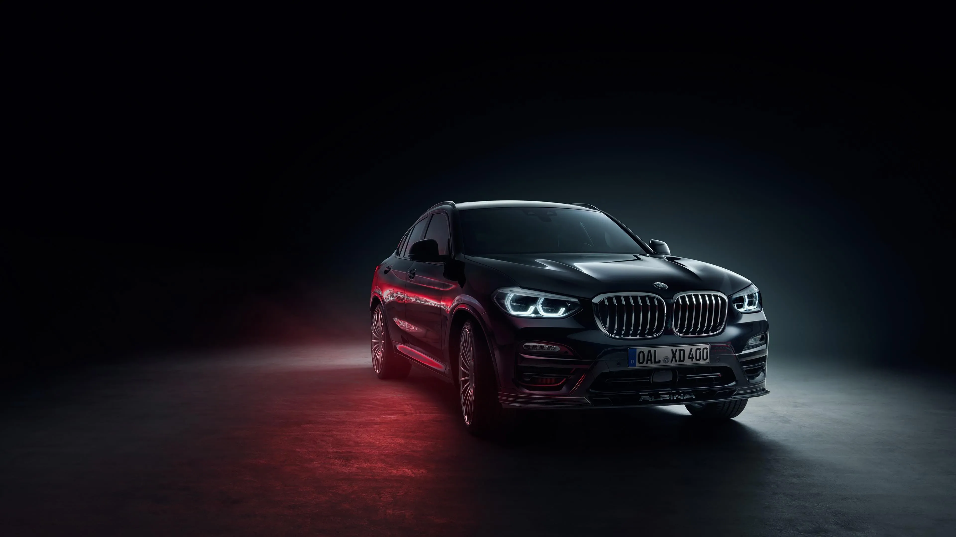 Black Bmw M Series in Dark Room with Red Backlight