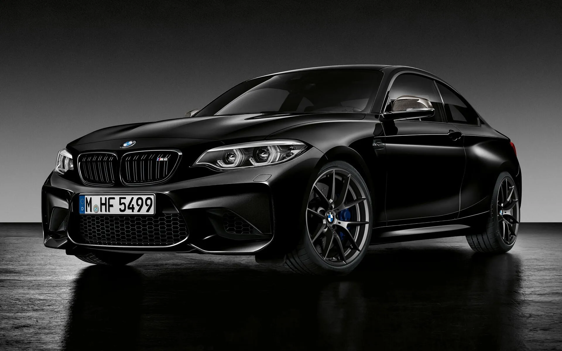 Black Bmw M Series Sports Car in Scenic Studio Setting