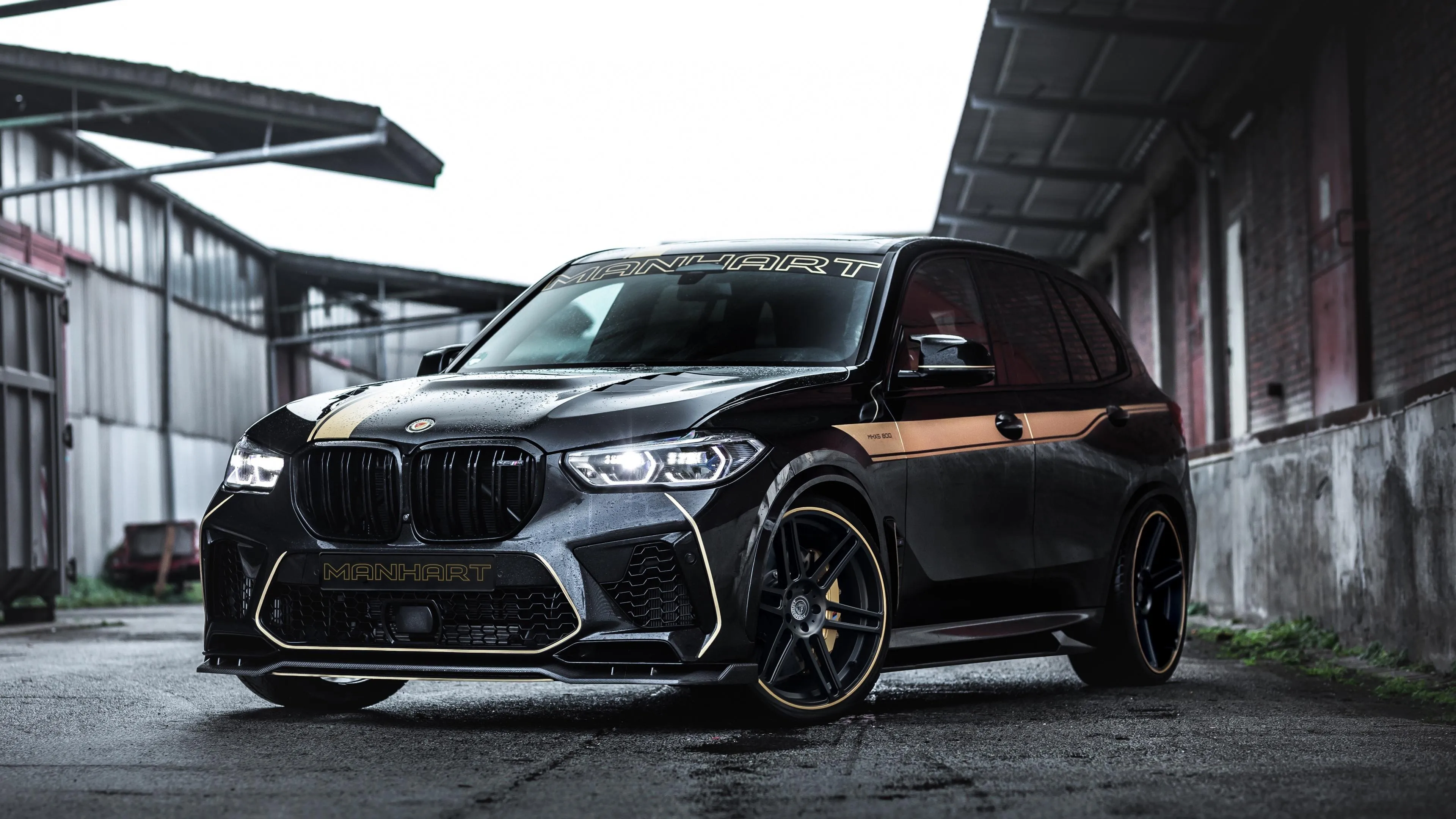 Black Bmw Parked in Industrial Urban Warehouse Wallpaper