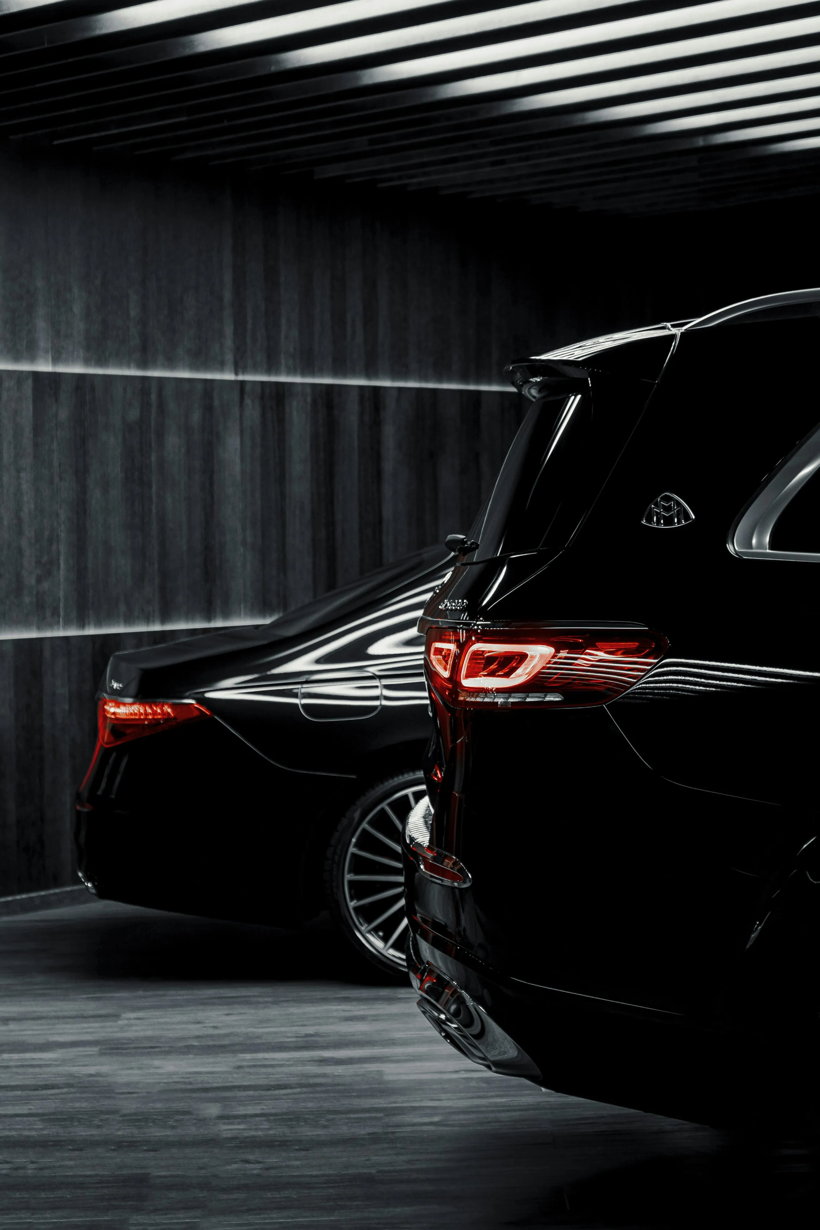 Black Bmw Parked in Tunnel Showing Rear and Taillights