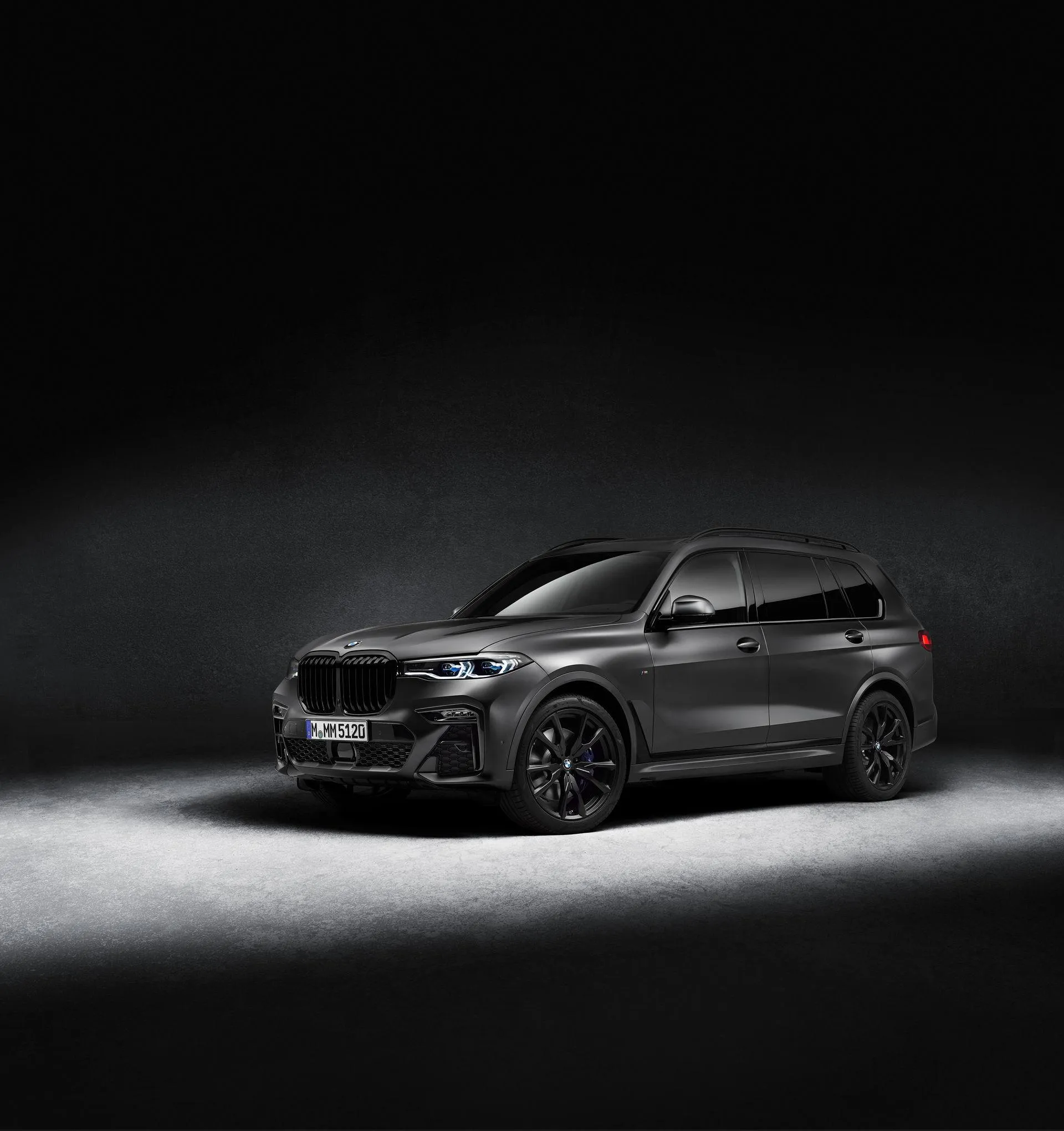 Black Bmw Sedan in Studio with Dramatic Shadow Light