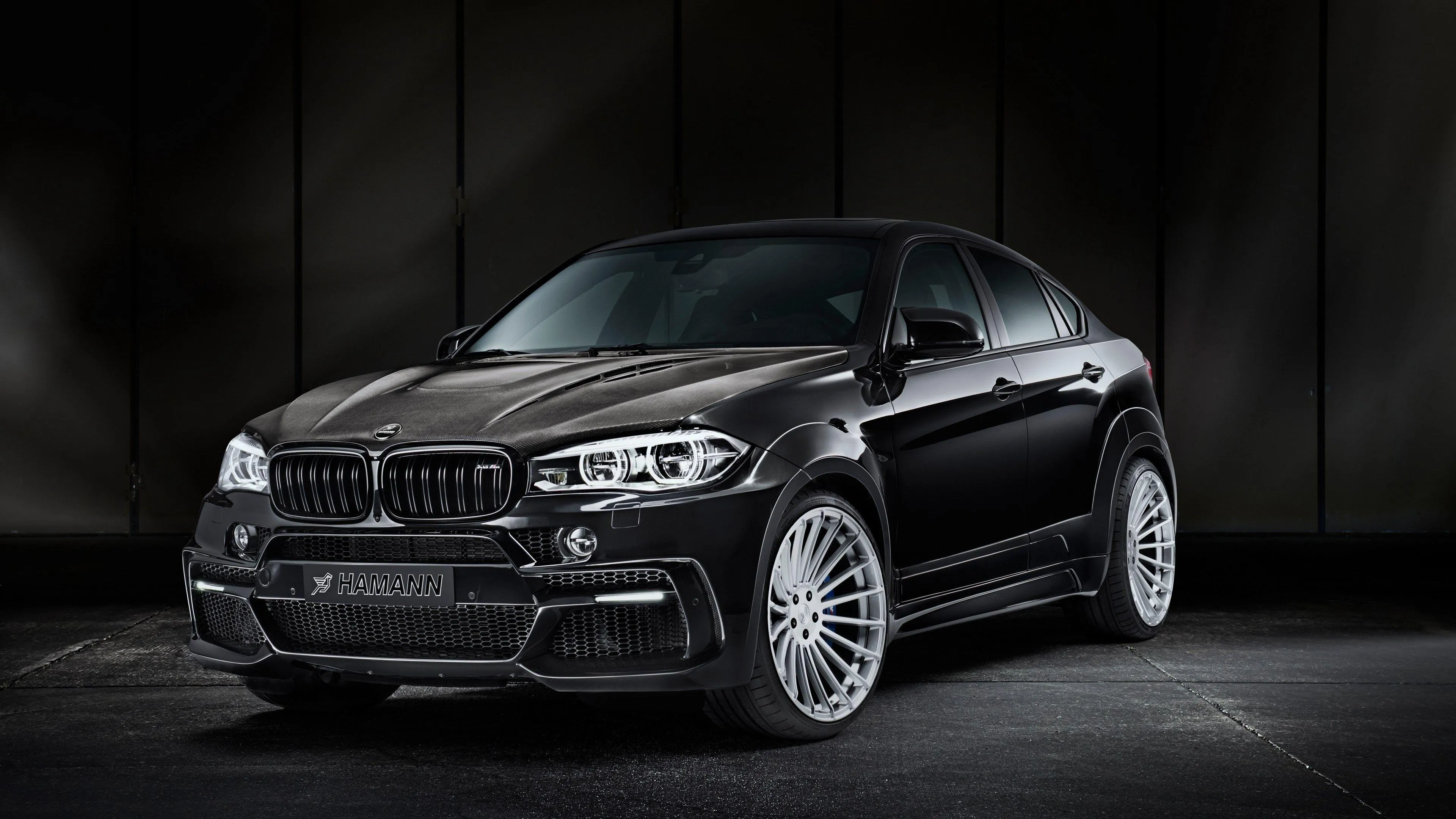 Black Bmw Suv in Dark Studio with Dramatic Spotlight